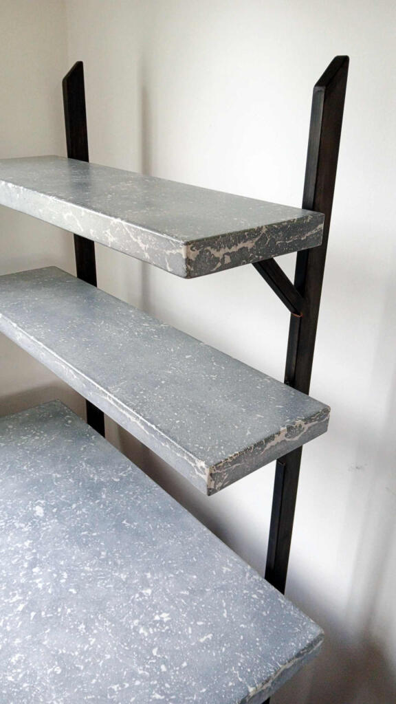 A bespoke, real concrete study desk with 2 concrete shelving. A unique artisan, marble-like concrete finish for elegance look, complemented with patina finish designer steel frame.
