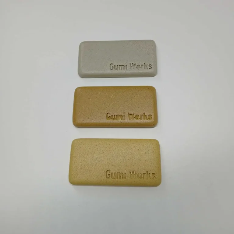 limestone, sand, and honey colour concrete sample blocks displayed on white background.