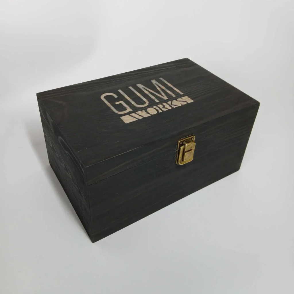 concrete colour sample box. Closed concrete sample box' Gumi Works Brand shown, an elegant, stylish, black stained natural wood box. cantain 20 custom blend concrete sample colour blocks, designed for interior designers and architects.