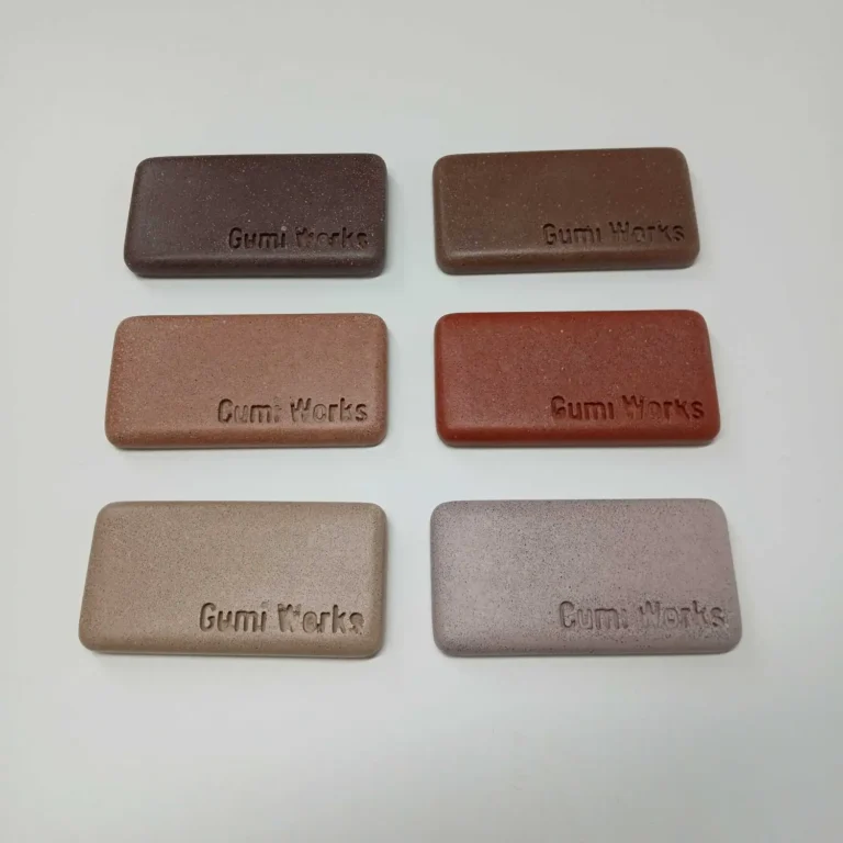 earth tones concrete samples group. showing; earthy brown, desert clay, Gumi Works London'S brick red, clay, sand, and lilac colours concrete sample blocks on white background.