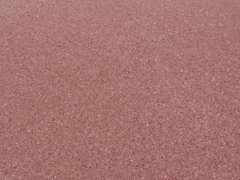 High-performance solid polished terracotta colour concrete finish for architectural surfaces and worktops.