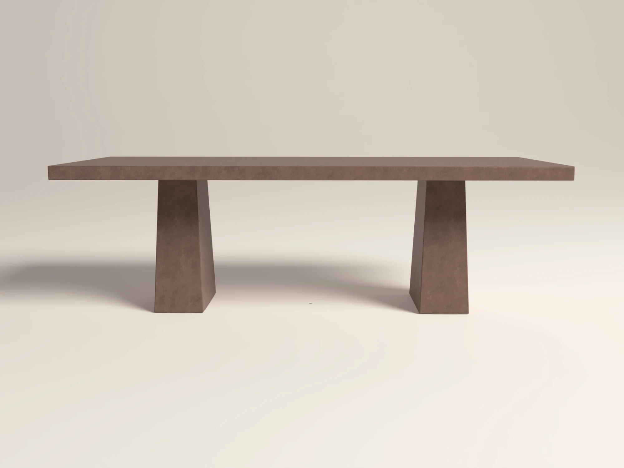 concrete-dining-table-rectangular-double-scultural-pedestal-base-clay-uk-london Rectangular concrete dining table with double pedestal base. Side view of table, finished in earthy colour polished concrete.