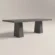 concrete-dining-table-rectangular-double-scultural-pedestal-base-lower-back-uk-london Bespoke concrete dining table, rectangle tabletop with architectural trapezoid double pedestal base. Cross angle view of table, finished in dark grey colour polished concrete.