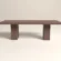 Earthy colour concrete dining table in modern brutalist style -rectangular double pedestal table for indoor and outdoor use in the UK.
