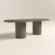 oval-concrete-dining-table-double-pedestal-lower-back-london-bespoke Concrete dining table in oval, pill-shape top with double circular pedestal base. Shown in earthy polished concrete finish.
