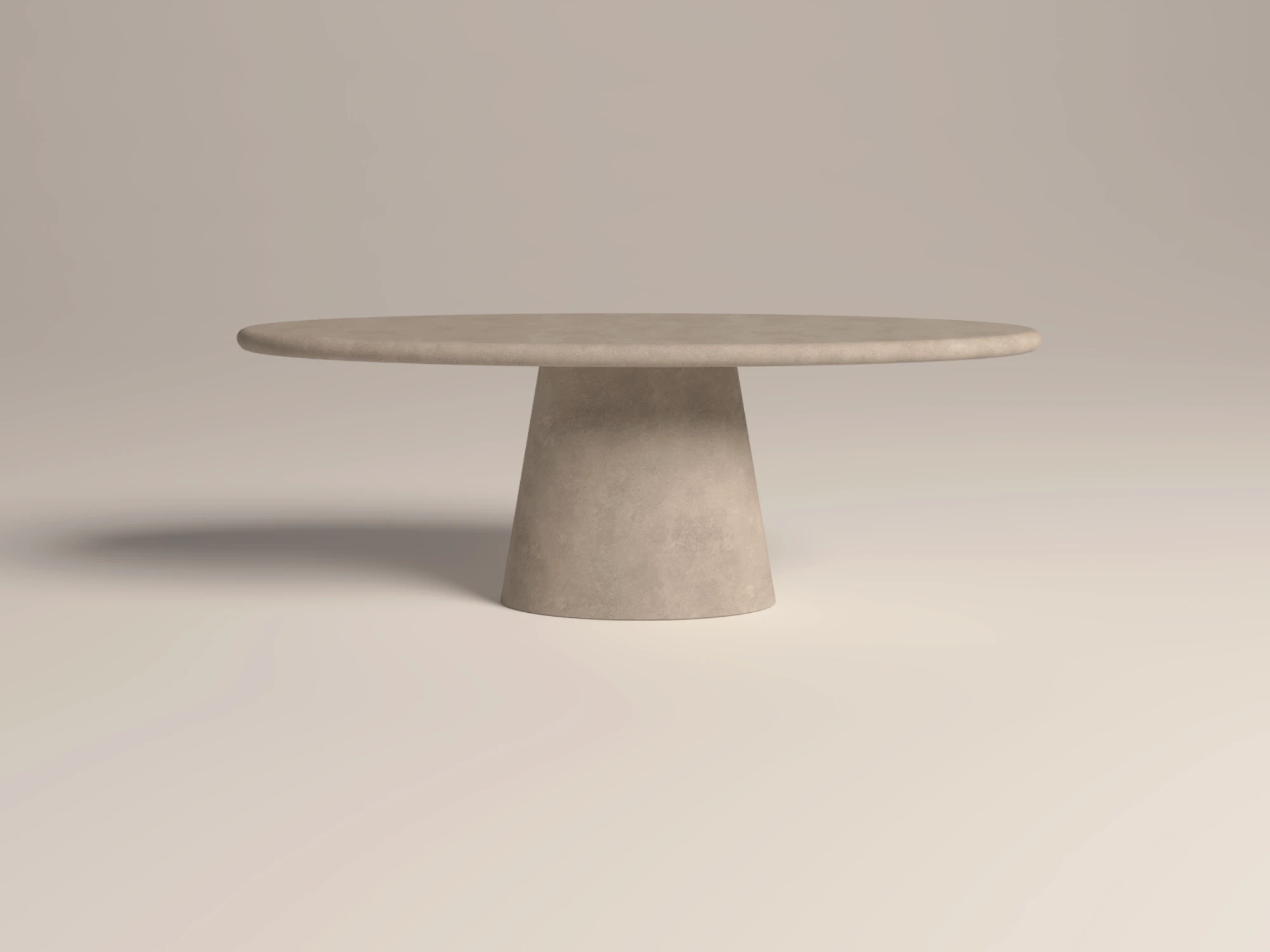 oval-concrete-dining-table-pedestal-dune-side-view-uk Oval dining table with pedestal base. Side view of table, made with gfrc concrete, in sand colour. Has a modern minimalist look to suit contemporary interiors -handmade in London studio.