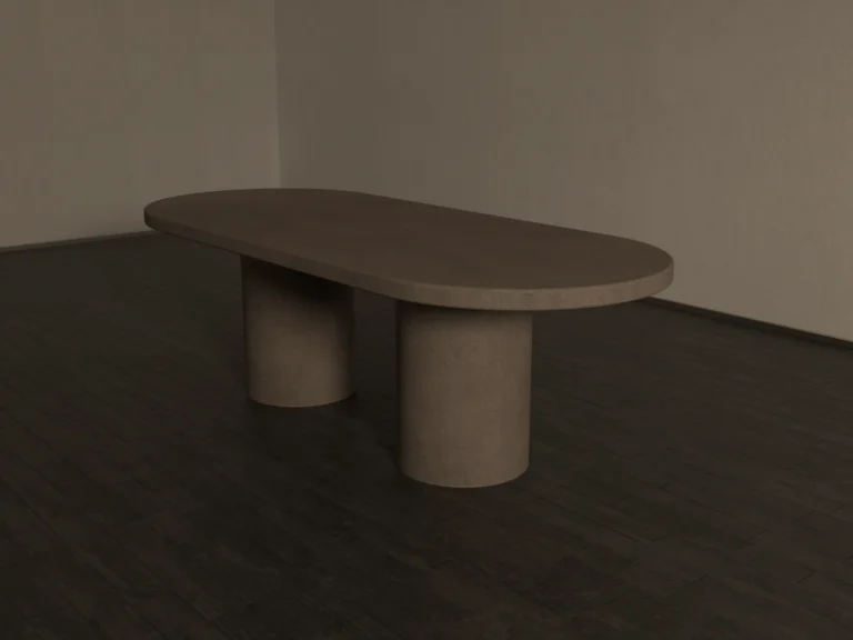 Pill shaped concrete dining table with double circular pedestal base. Cross angle view of table, showing soft modern design lines.