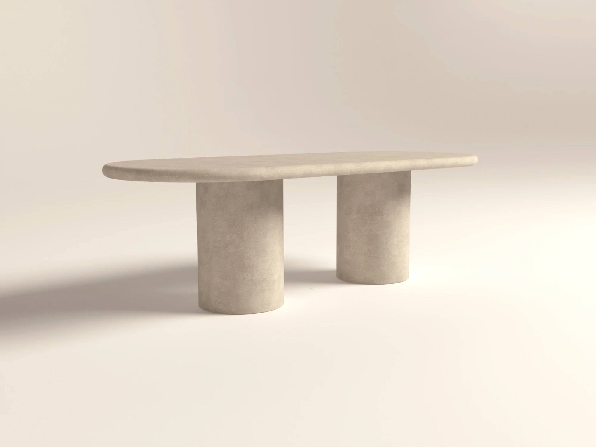pill-shaped-oval-dining-table-polished-concrete-soft-minimalist-perspective-view-uk Pill shaped, oval racetrack dining table with double pedestal base. Made with gfrc concrete. Shown in lower back angle.