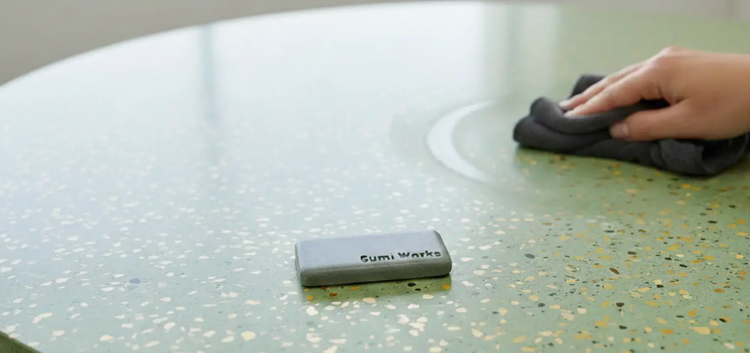 close-up image showing cleaning of polished terrazzo concrete surface in London.