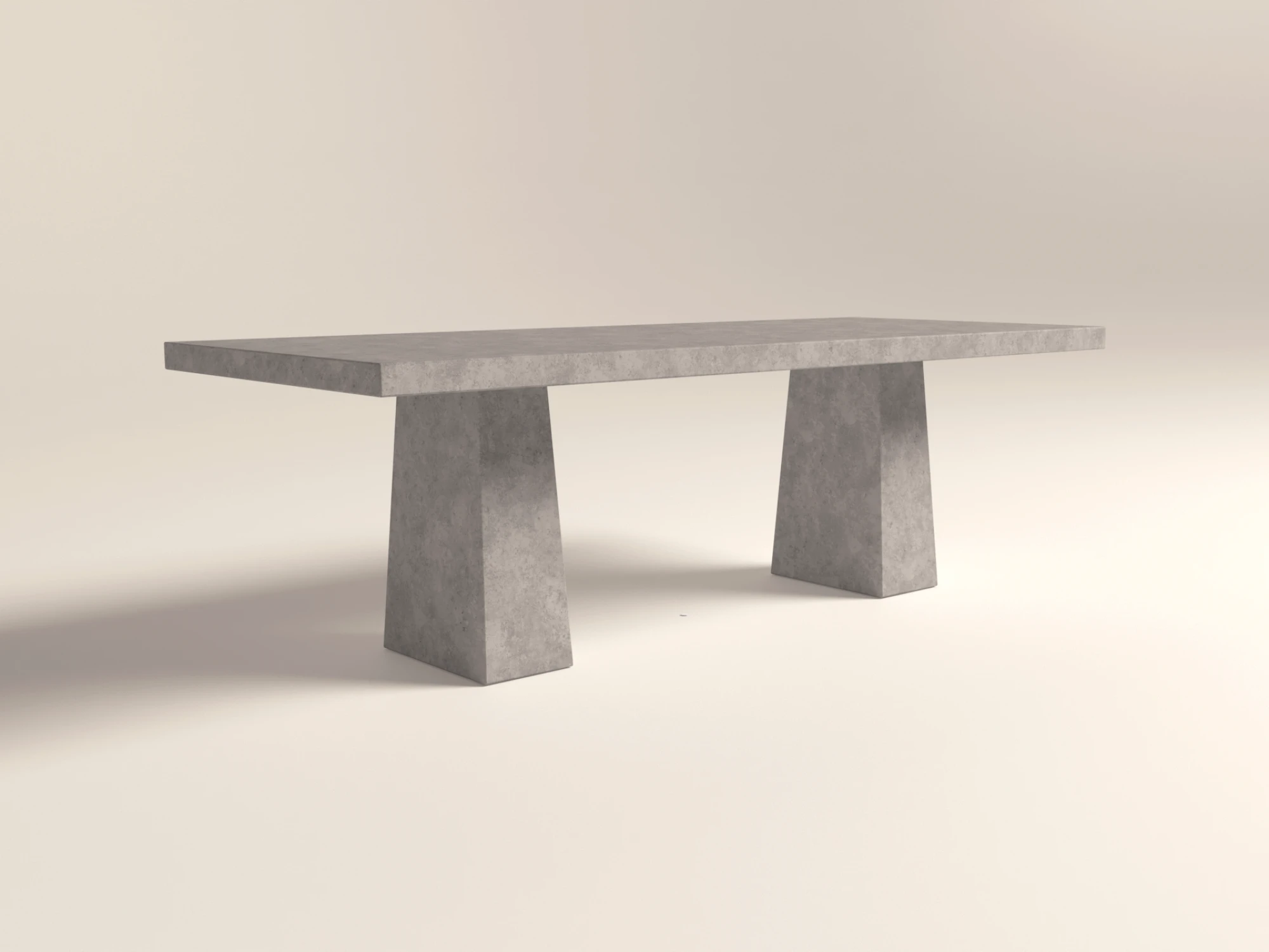 rectangle-concrete-dining-table-pedestal-grey-london-uk Rectangular concrete dining table with architectural trapezoid double pedestal base. Cross angle view of table, finished in grey colour polished concrete.