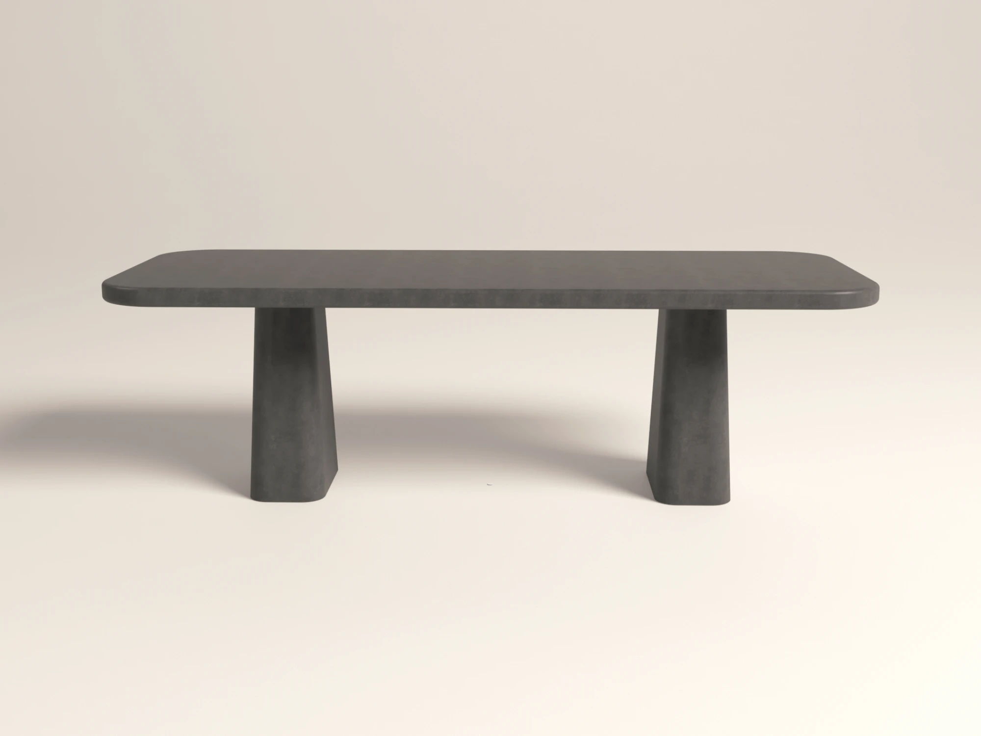 rounded-rectangular-concrete-dining-table-double-pedestal-anthracite-side-london-uk Rounded rectangular concrete dining table with sculptural double pedestal base. Side-view of table, finished in anthracite colour polished concrete - London UK.