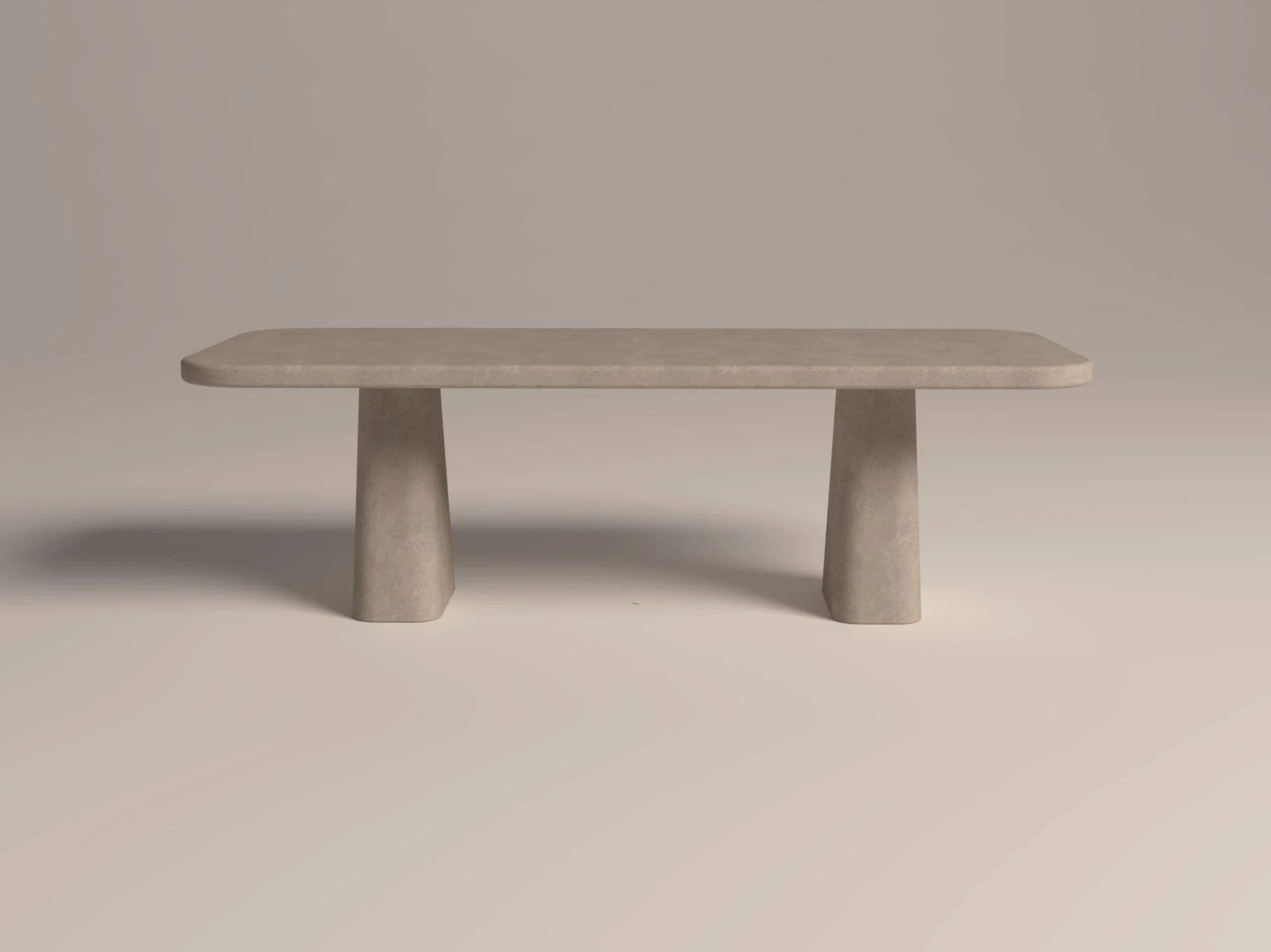 rounded-rectangular-concrete-dining-table-sculptural-pedestal-limestone=front-london-uk Rounded rectangular concrete dining table with sculptural double pedestal base. Side-view of table, finished in limestone colour polished concrete - London UK.