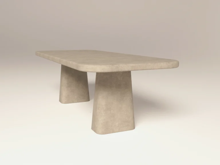 Rounded rectangular concrete dining table with sculptural double pedestal base. Front of table, finished in limestone colour polished concrete - London UK.