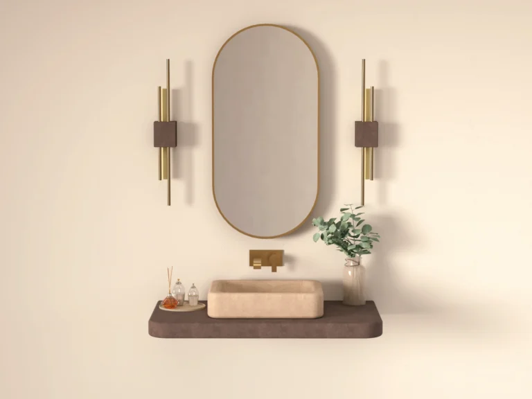 Hand-cast concrete basin on concrete vanity shelf, sand finish, soft modern bathroom setting with natural light and eucalyptus — Gumi Works London studio.