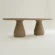 concrete-scultural-table-mediterranean-decor-uk-interior-outdoor-living A high-end, Sculptural Pedestal Concrete Dining Table. Cross-view studio shot of the concrete table on white background.
