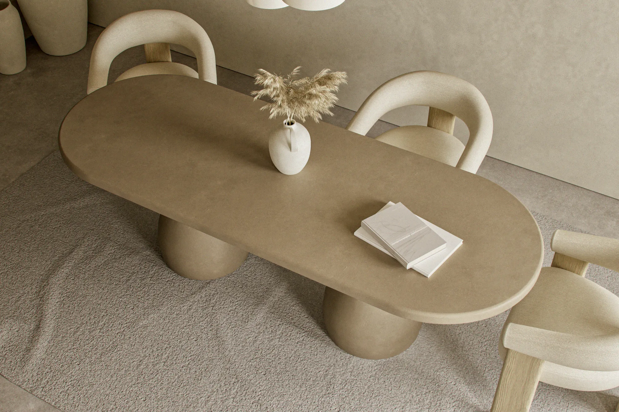 oval-luxury-dining-table-concrete-pedestal-soft-uk-interior High room shot of a luxury solid concrete oval table highlighting how the curvy sculptural bases and oval tabletop complement an organic modern dining room with soft architectural lighting.